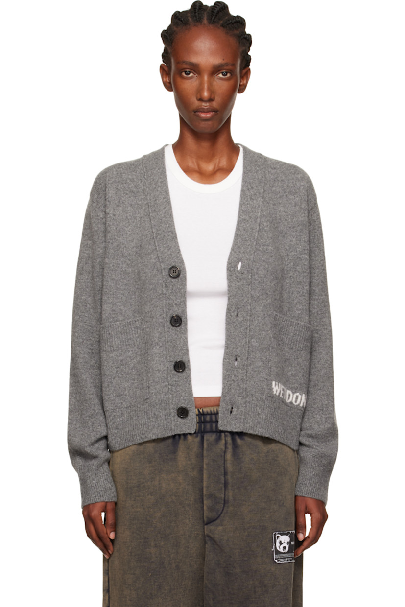 Brushed knit wool-blend cardigan.

· Rib-knit Y-neck, hem, and cuffs
· Button closure
· Patch pockets at waist
· Intarsia logo at pocket

Supplier color: Charcoal
