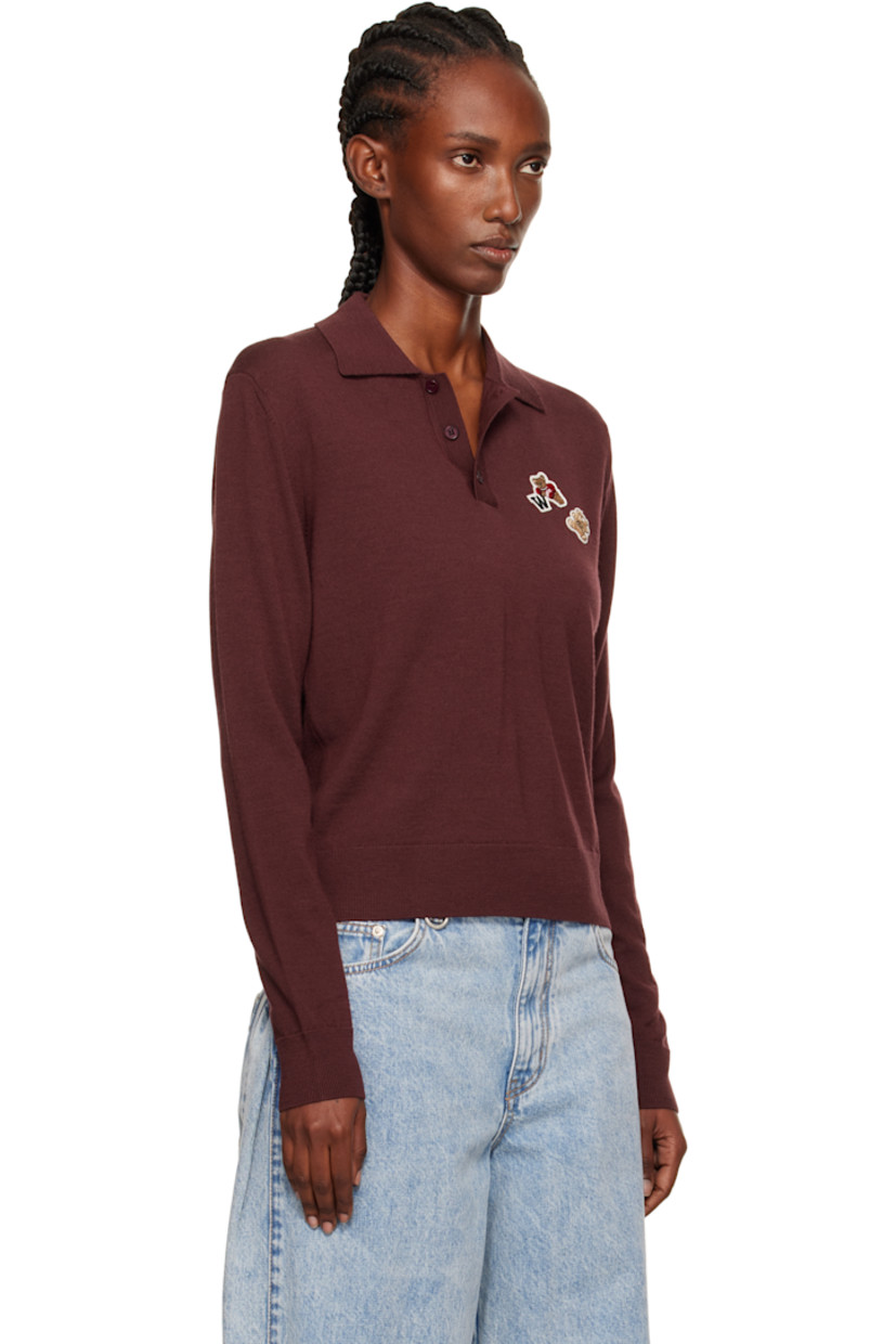 Knit wool polo.

· Rib-knit spread collar, hem, and cuffs
· Three-button placket
· Embroidered logo patches at chest

Supplier color: Wine