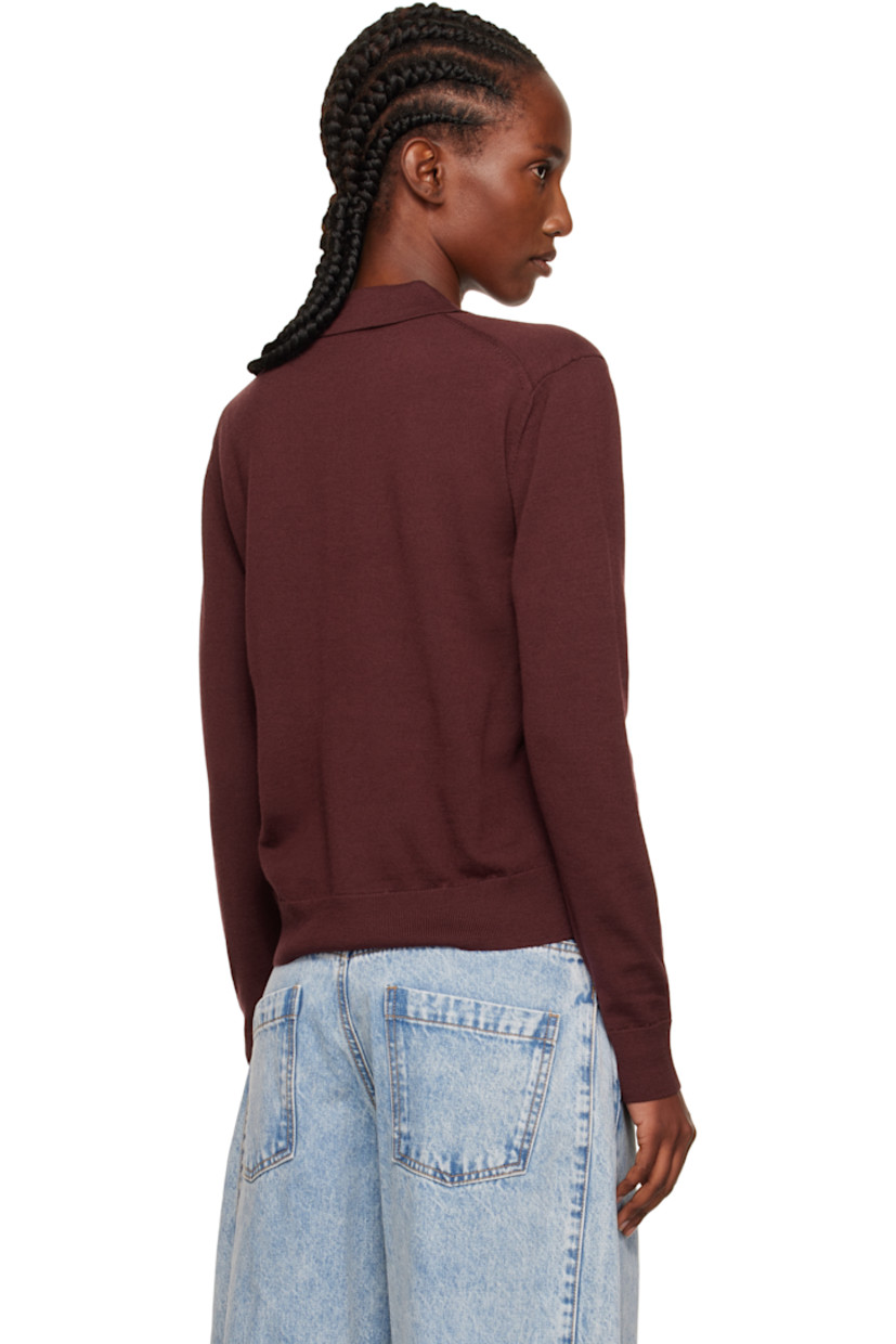Knit wool polo.

· Rib-knit spread collar, hem, and cuffs
· Three-button placket
· Embroidered logo patches at chest

Supplier color: Wine