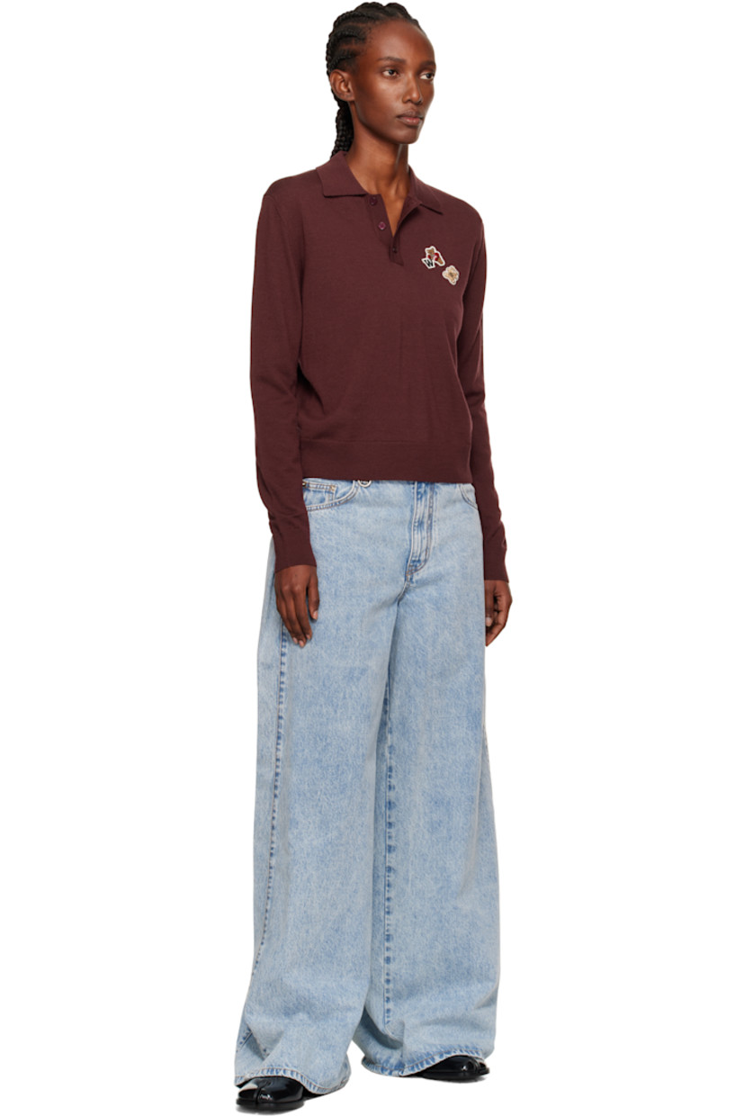 Knit wool polo.

· Rib-knit spread collar, hem, and cuffs
· Three-button placket
· Embroidered logo patches at chest

Supplier color: Wine