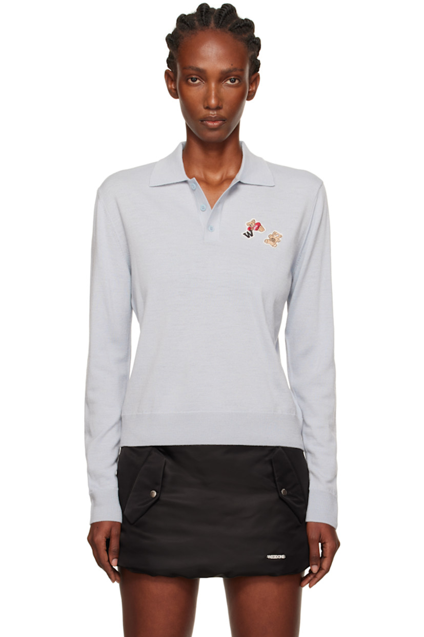 Knit wool polo.

· Rib-knit spread collar, hem, and cuffs
· Three-button placket
· Embroidered logo patches at chest

Supplier color: Grey