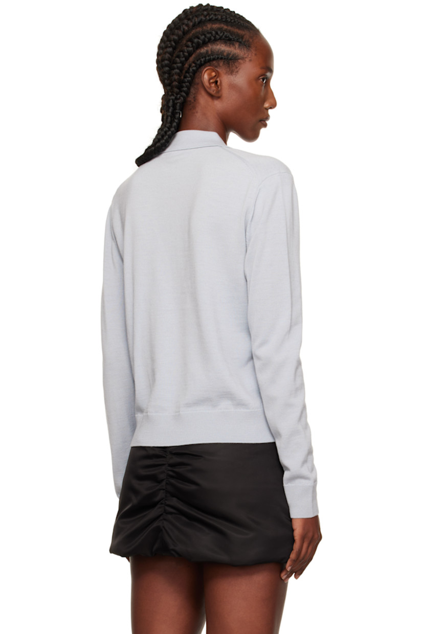 Knit wool polo.

· Rib-knit spread collar, hem, and cuffs
· Three-button placket
· Embroidered logo patches at chest

Supplier color: Grey