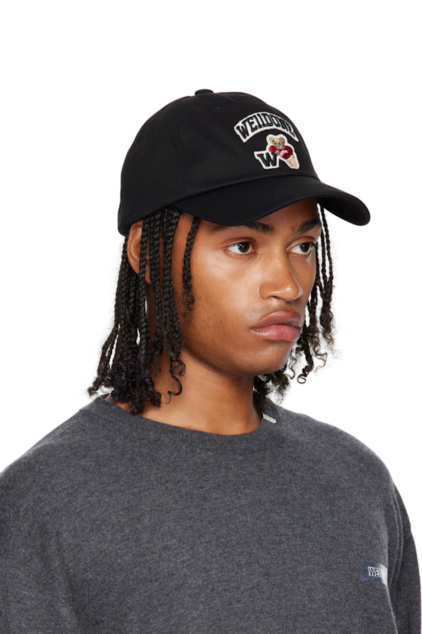 Cotton twill cap.

· Embroidered eyelets at crown
· Embroidered logo and graphic appliqué at face 
· Curved brim 
· Cinch fastening at back
· Twill browband

Supplier color: Black
