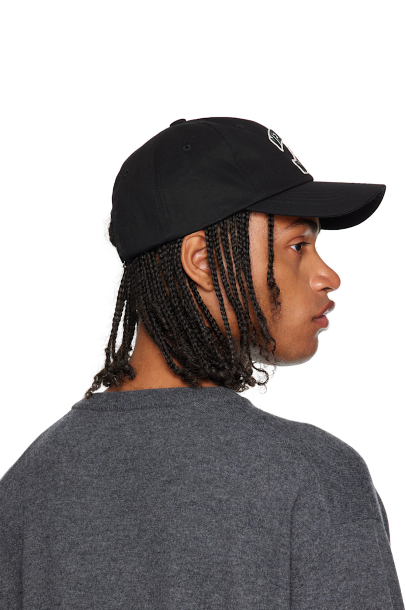 Cotton twill cap.

· Embroidered eyelets at crown
· Embroidered logo and graphic appliqué at face 
· Curved brim 
· Cinch fastening at back
· Twill browband

Supplier color: Black