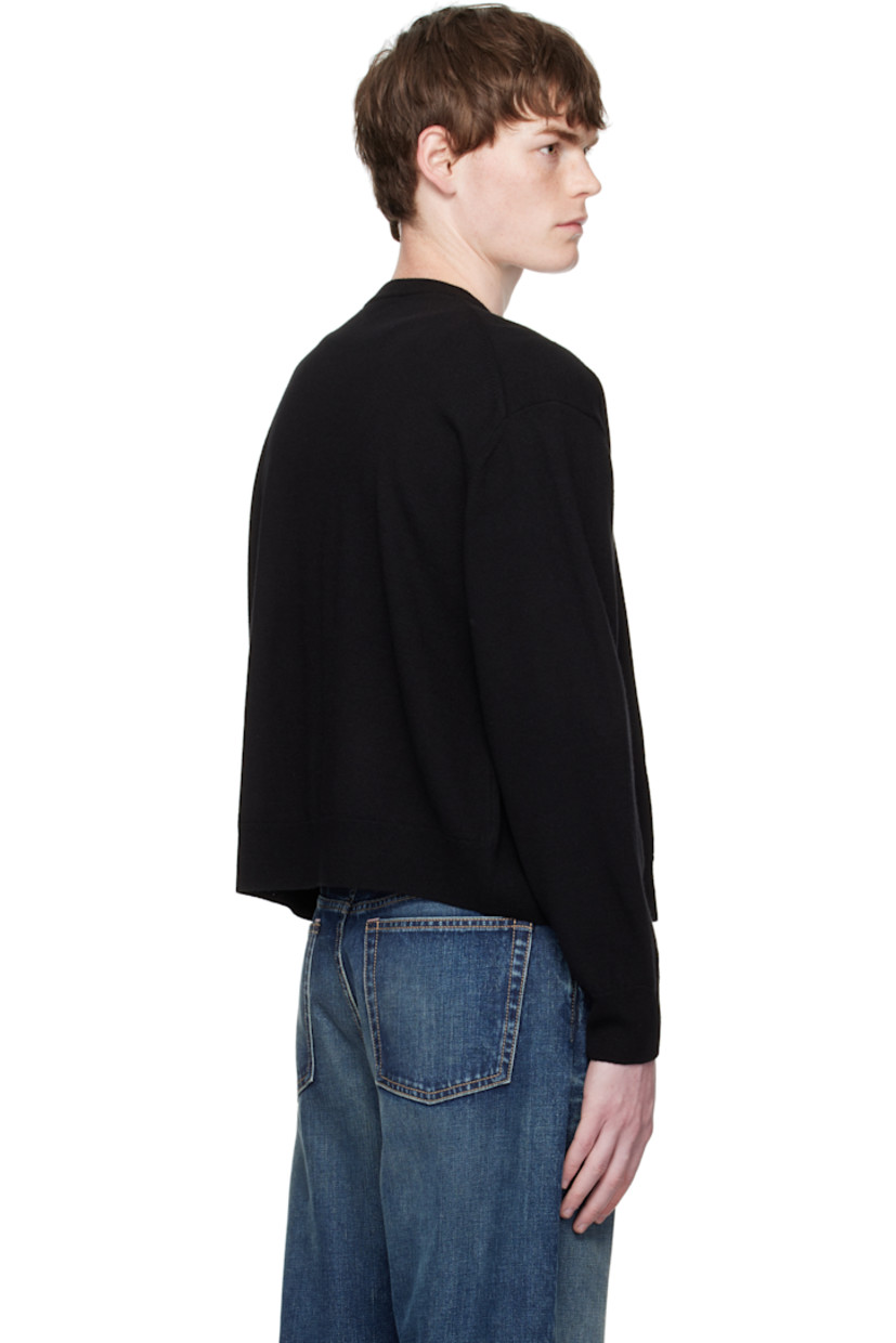 Knit wool cardigan.

· Rib-knit round neck, hem, and cuffs
· Button closure
· Graphic embroidered at chest
· Dropped shoulders

Supplier color: Black