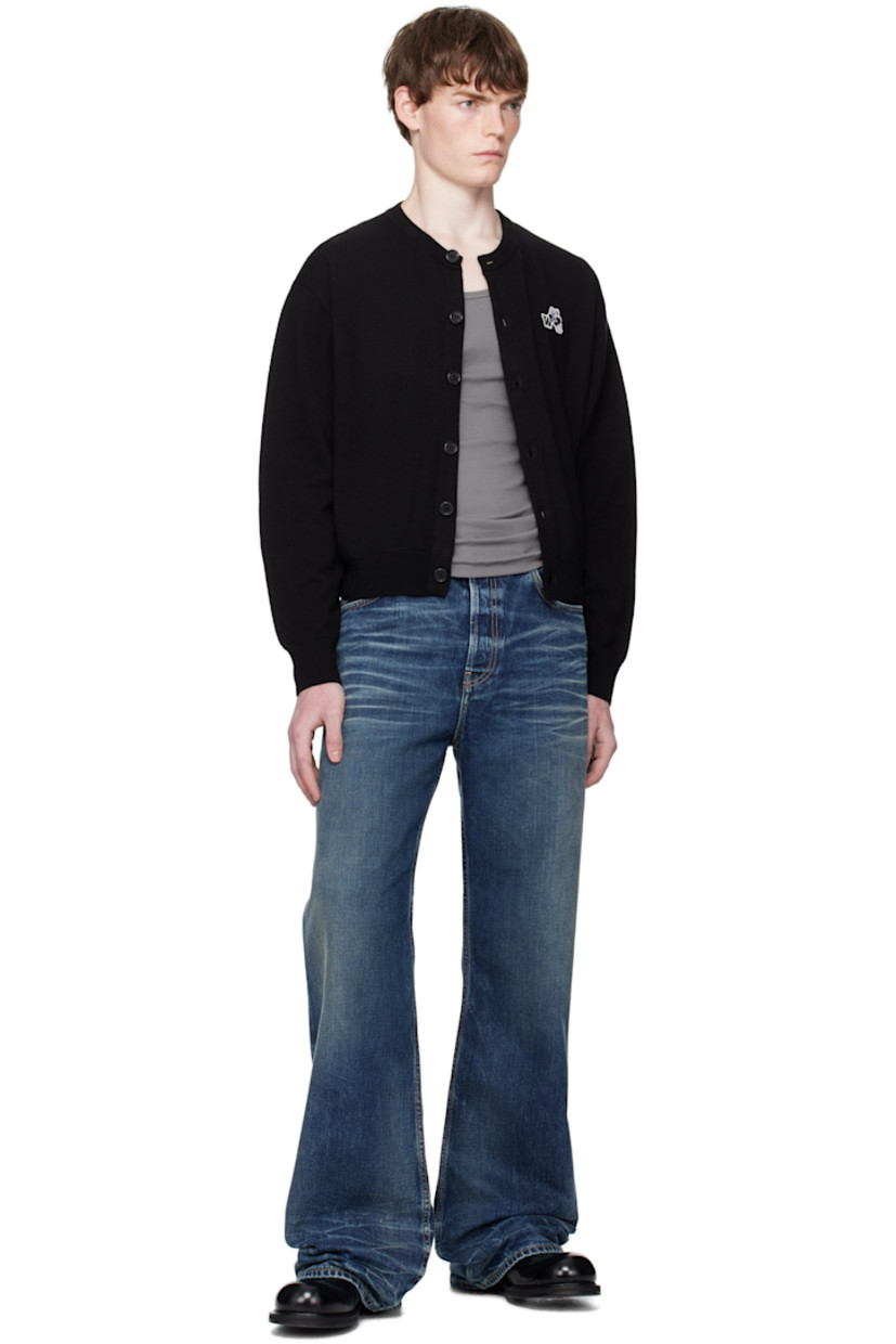 Knit wool cardigan.

· Rib-knit round neck, hem, and cuffs
· Button closure
· Graphic embroidered at chest
· Dropped shoulders

Supplier color: Black