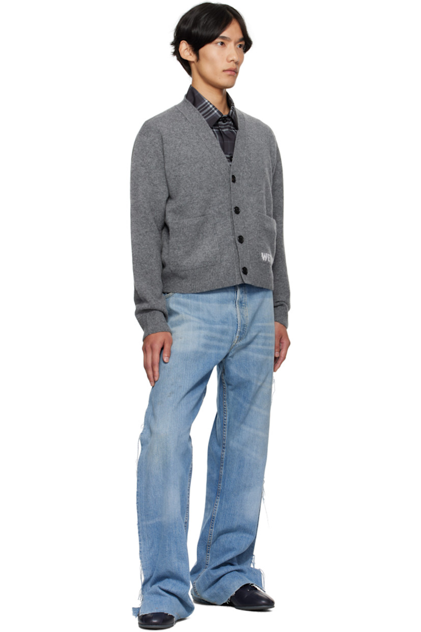 Knit wool-blend cardigan.

· Rib-knit Y-neck, hem, and cuffs
· Button closure
· Patch pockets and jacquard logo at front

Supplier color: Charcoal