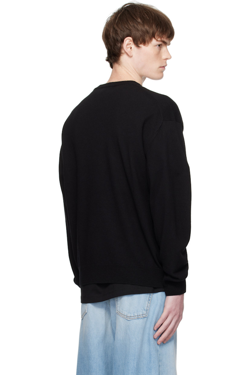 Knit wool sweater.

· Rib-knit crewneck, hem, and cuffs
· Printed logo with crystal-cut accents at chest
· Dropped shoulders

Supplier color: Black