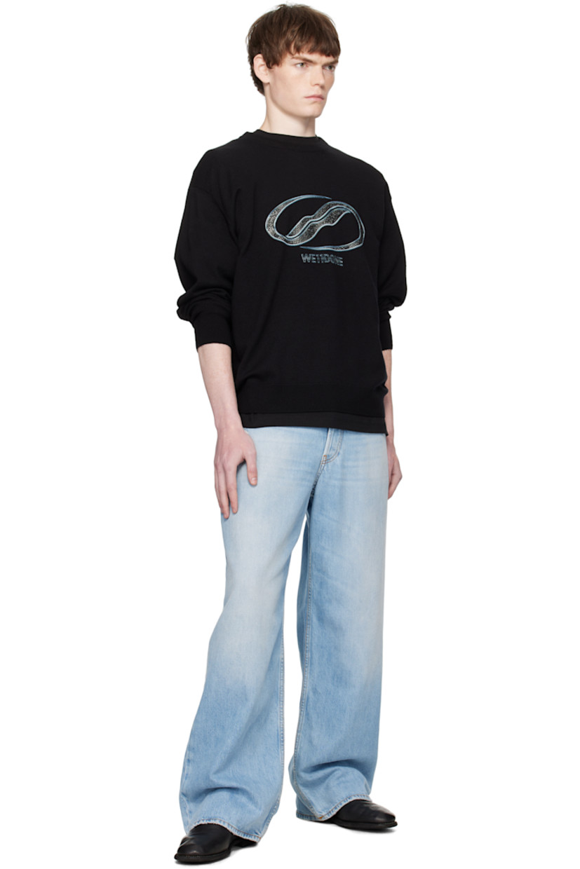 Knit wool sweater.

· Rib-knit crewneck, hem, and cuffs
· Printed logo with crystal-cut accents at chest
· Dropped shoulders

Supplier color: Black