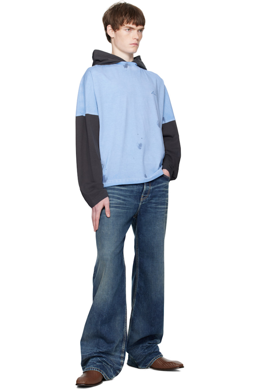 Cotton jersey hoodie.

· Paint splatter pattern throughout
· Logo embroidered at chest
· Dropped shoulders
· Paneled sleeves

Supplier color: Blue