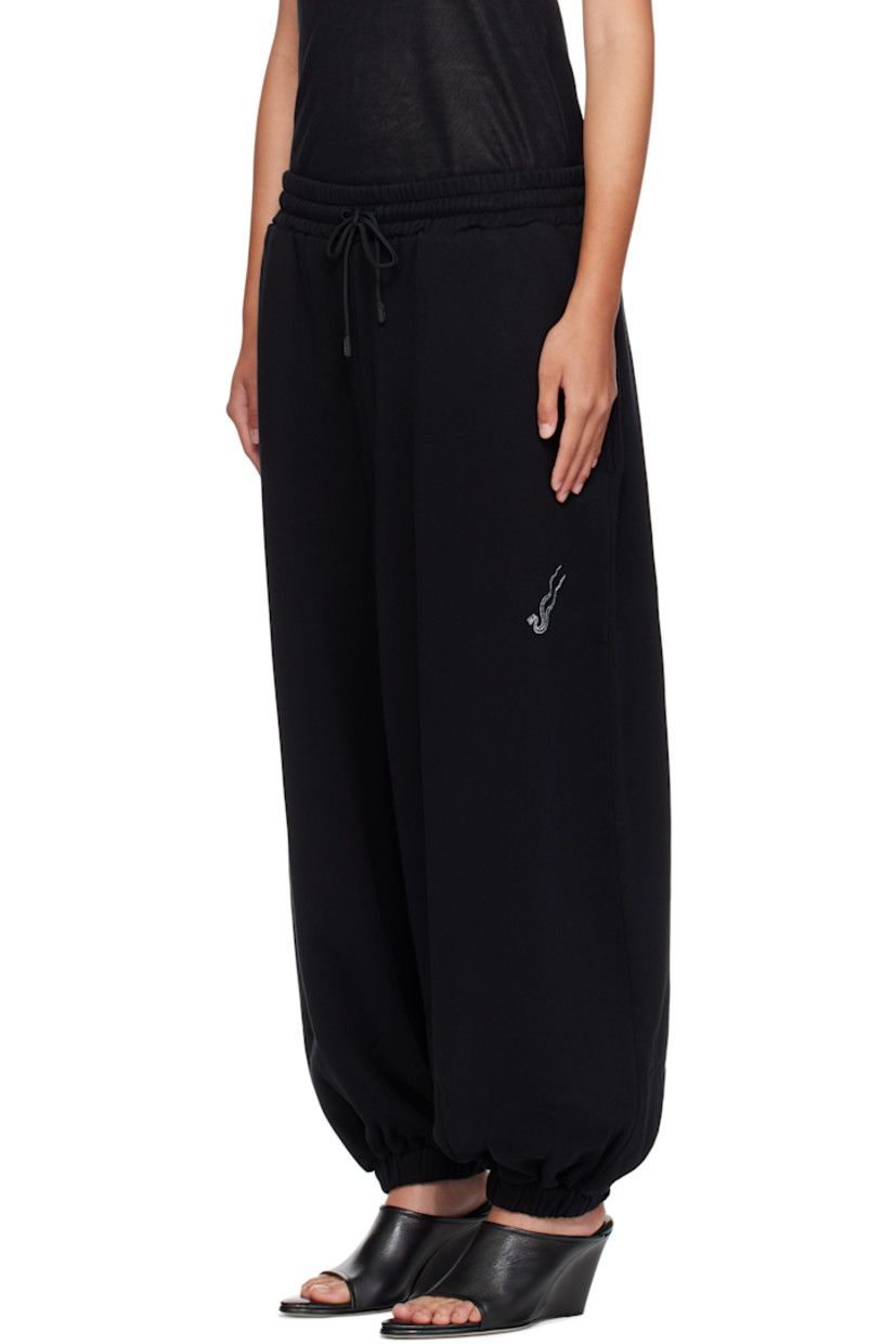Cotton fleece lounge pants.

· Drawstring at elasticized waistband
· Three-pocket styling
· Logo graphic embroidered at leg
· Elasticized cuffs

Supplier color: Black