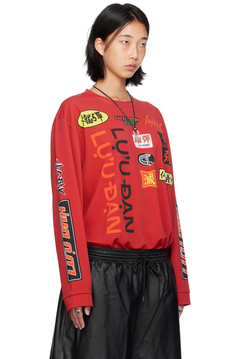 Polyester mesh jersey. 

· Crewneck
· Logo, text, and graphics printed at front and sleeves
· Dropped shoulders

Supplier color: Motocross/Blood red
