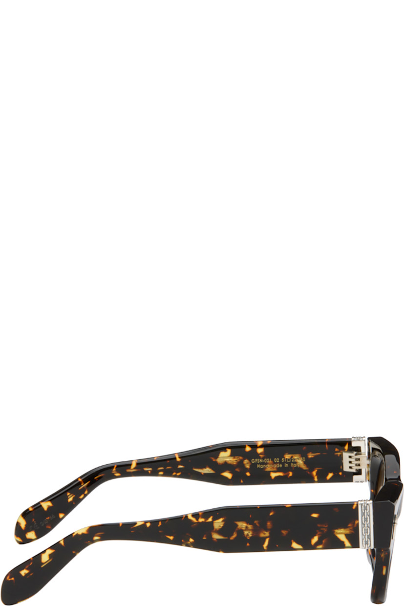Handcrafted square semi-transparent tortoiseshell acetate-frame sunglasses.

· Gradient gray lenses
· 100% UVA/UVB protection
· Integrated nose pads
· Sterling silver graphic hardware at face and temples
· Core wire at temples
· Includes case
· Size: 51.22 150

Part of the Cutler and Gross x The Great Frog collaboration.

Supplier color: Black on havana