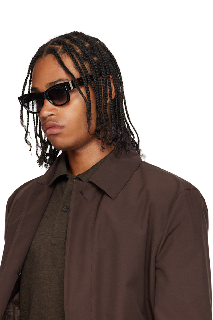 Handcrafted square semi-transparent tortoiseshell acetate-frame sunglasses.

· Gradient gray lenses
· 100% UVA/UVB protection
· Integrated nose pads
· Sterling silver graphic hardware at face and temples
· Core wire at temples
· Includes case
· Size: 51.22 150

Part of the Cutler and Gross x The Great Frog collaboration.

Supplier color: Black on havana