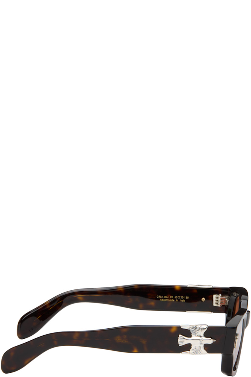 Handcrafted rectangular semi-transparent tortoiseshell acetate-frame sunglasses.

· Orange lenses
· 100% UVA/UVB protection
· Integrated nose pads
· Sterling silver graphic hardware at face and temples
· Exposed core wires
· Includes case
· Size: 50.23 150

Part of the Cutler and Gross x The Great Frog collaboration.

Supplier color: Havana