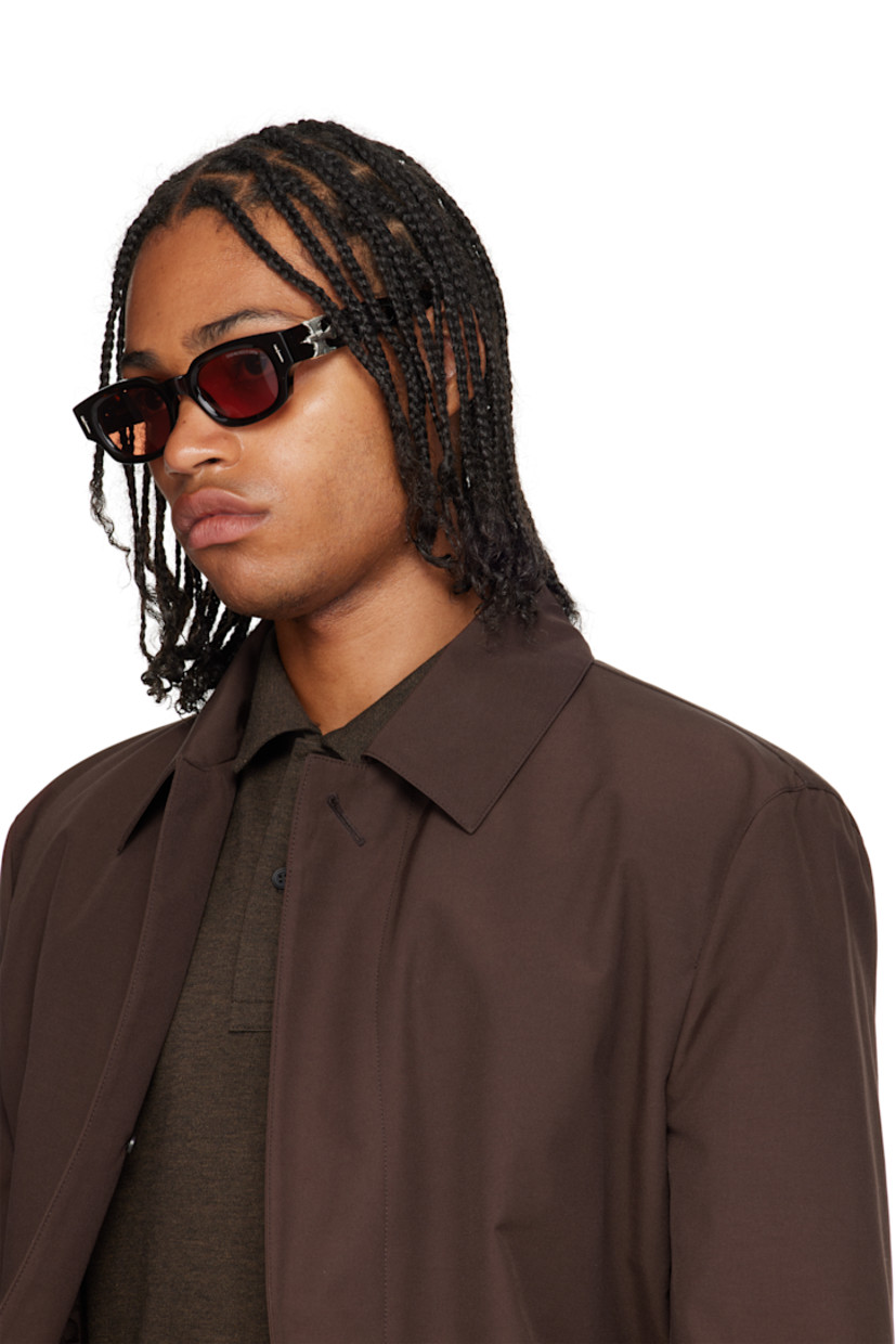 Handcrafted rectangular semi-transparent tortoiseshell acetate-frame sunglasses.

· Orange lenses
· 100% UVA/UVB protection
· Integrated nose pads
· Sterling silver graphic hardware at face and temples
· Exposed core wires
· Includes case
· Size: 50.23 150

Part of the Cutler and Gross x The Great Frog collaboration.

Supplier color: Havana