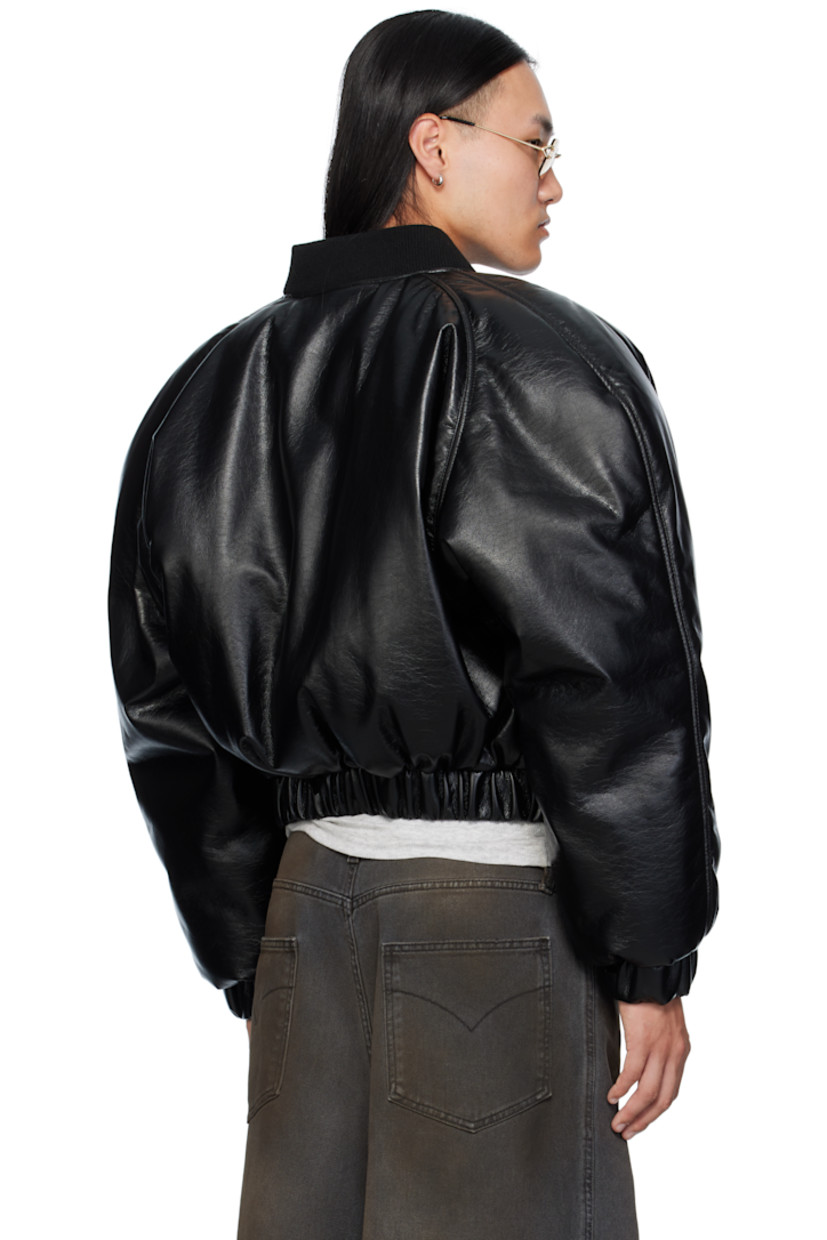 Padded crackled faux-leather bomber jacket. 

· Rib-knit stand collar 
· Zip closure
· Zip pockets at chest
· Welt pockets at waist 
· Elasticized hem and cuffs
· Raglan sleeves
· Full satin lining 

Supplier color: Black