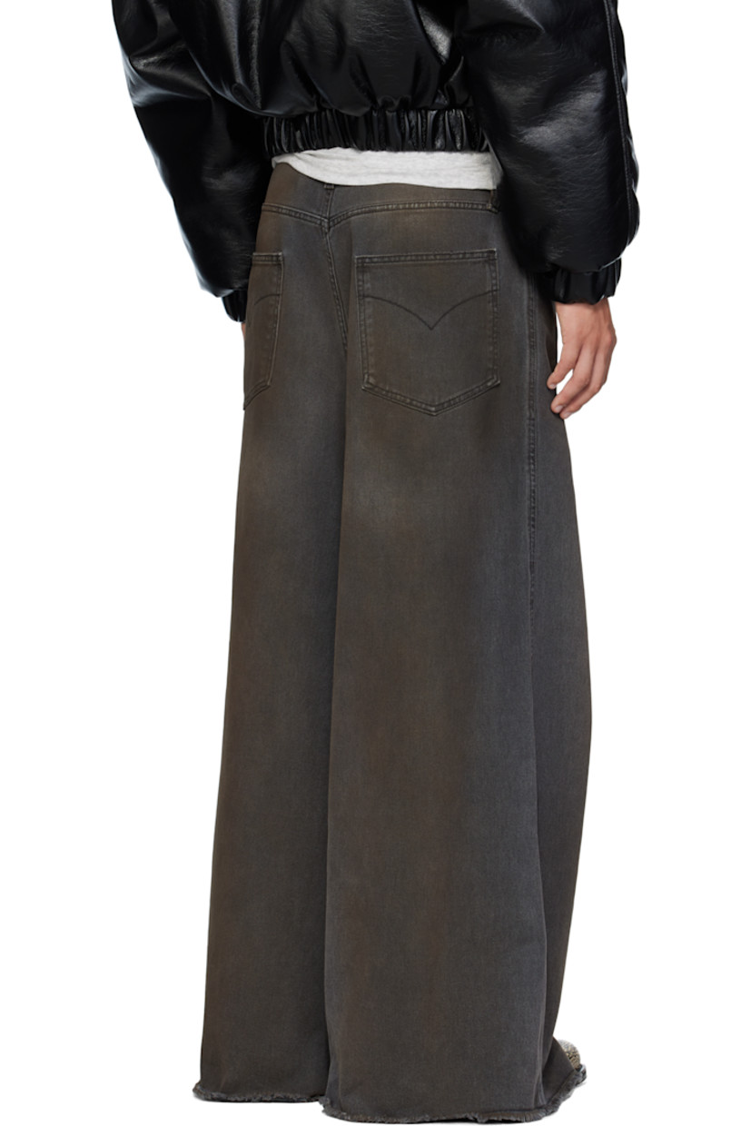 Non-stretch denim jeans.

· Wide-leg 
· Fading, whiskering, smudging, and distressing throughout 
· Belt loops
· Five-pocket styling
· Zip fly 
· Concealed drawstring at waistband 
· Hammer loop at front pocket 
· Raw edge at cuffs
· Logo patch at back waistband
· Logo-engraved silver-tone hardware

Supplier color: Dirty outcast grey