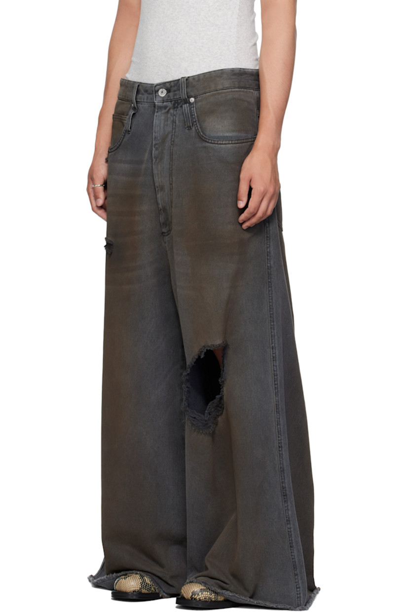Non-stretch denim jeans.

· Wide-leg 
· Fading, whiskering, smudging, and distressing throughout 
· Belt loops
· Five-pocket styling
· Zip fly 
· Concealed drawstring at waistband 
· Hammer loop at front pocket 
· Raw edge at cuffs
· Logo patch at back waistband
· Logo-engraved silver-tone hardware

Supplier color: Dirty outcast grey