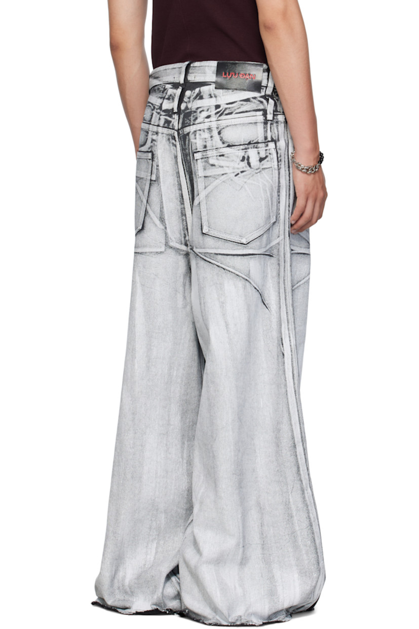 Coated non-stretch denim jeans.

· Belt loops
· Concealed drawstring at waistband 
· Five-pocket styling
· Zip fly 
· Hammer loop at front pocket 
· Raw edge at cuffs
· Logo patch at back waistband 
· Logo-engraved silver-tone hardware 

Supplier color: X-ray