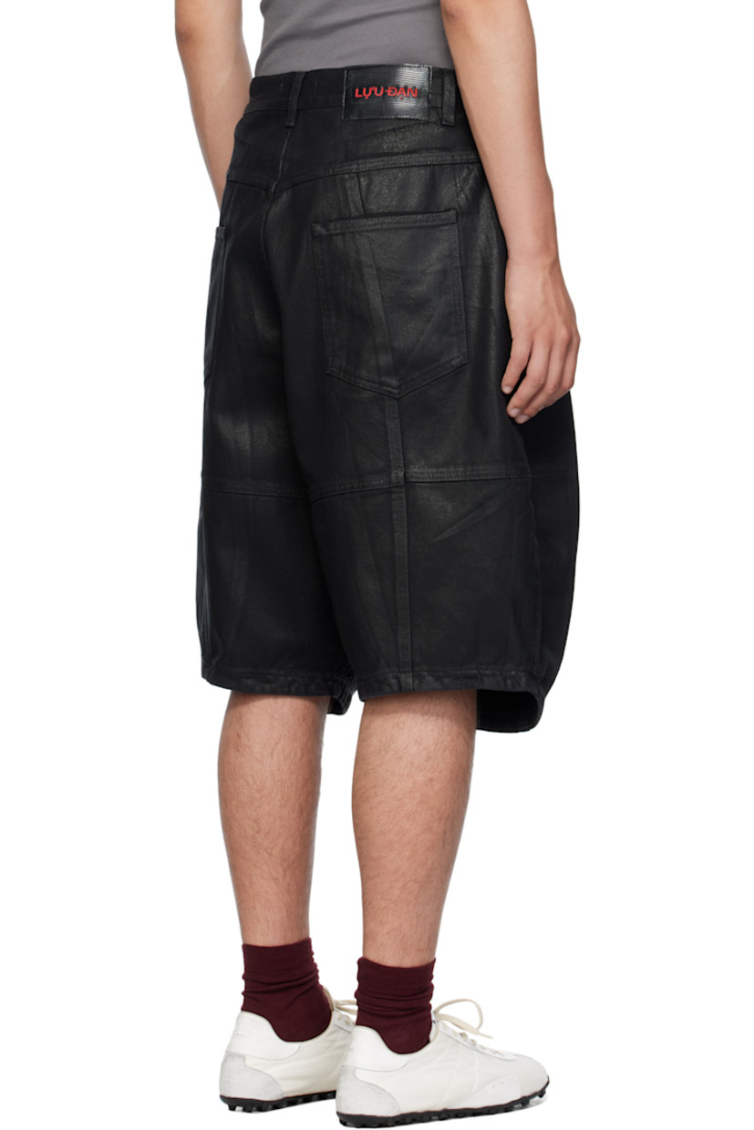 Coated non-stretch denim shorts.

· Belt loops
· Five-pocket styling
· Zip fly 
· Pleats and darts at front 
· Logo patch at back waistband
· Logo-engraved silver-tone hardware 

Supplier color: Coated black