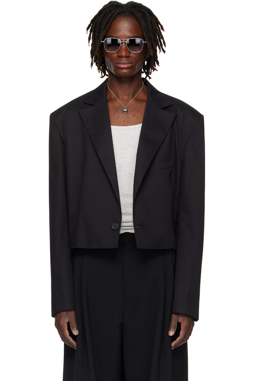 Cotton-blend twill blazer.

· Peaked lapel
· Single-button closure
· Welt pocket at chest
· Darts at waist
· Raw edge at cropped hem
· Buttoned surgeon's cuffs
· Central seam at back
· Welt pocket at interior
· Patterned satin lining

Supplier color: Black