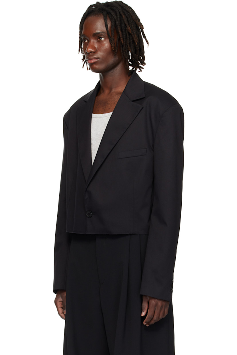 Cotton-blend twill blazer.

· Peaked lapel
· Single-button closure
· Welt pocket at chest
· Darts at waist
· Raw edge at cropped hem
· Buttoned surgeon's cuffs
· Central seam at back
· Welt pocket at interior
· Patterned satin lining

Supplier color: Black