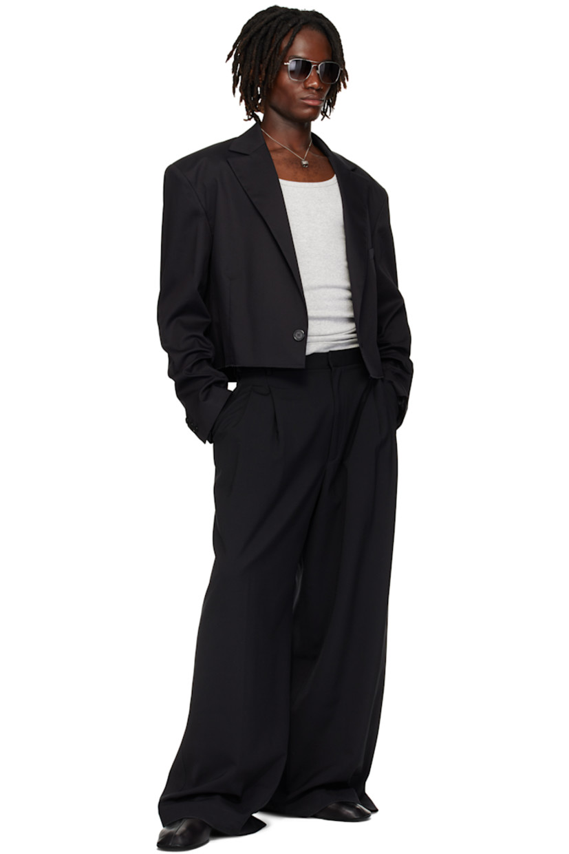 Cotton-blend twill blazer.

· Peaked lapel
· Single-button closure
· Welt pocket at chest
· Darts at waist
· Raw edge at cropped hem
· Buttoned surgeon's cuffs
· Central seam at back
· Welt pocket at interior
· Patterned satin lining

Supplier color: Black