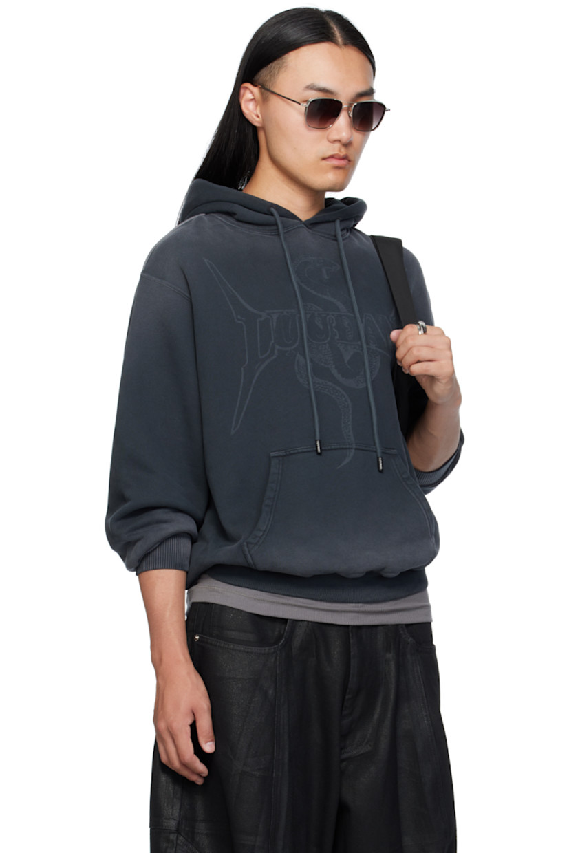 French terry hoodie. 

· Fading throughout 
· Drawstring at hood
· Logo and graphic printed at front 
· Kangaroo pocket
· Rib-knit hem and cuffs
· Dropped shoulders 

Supplier color: Metal snake/Black smoke