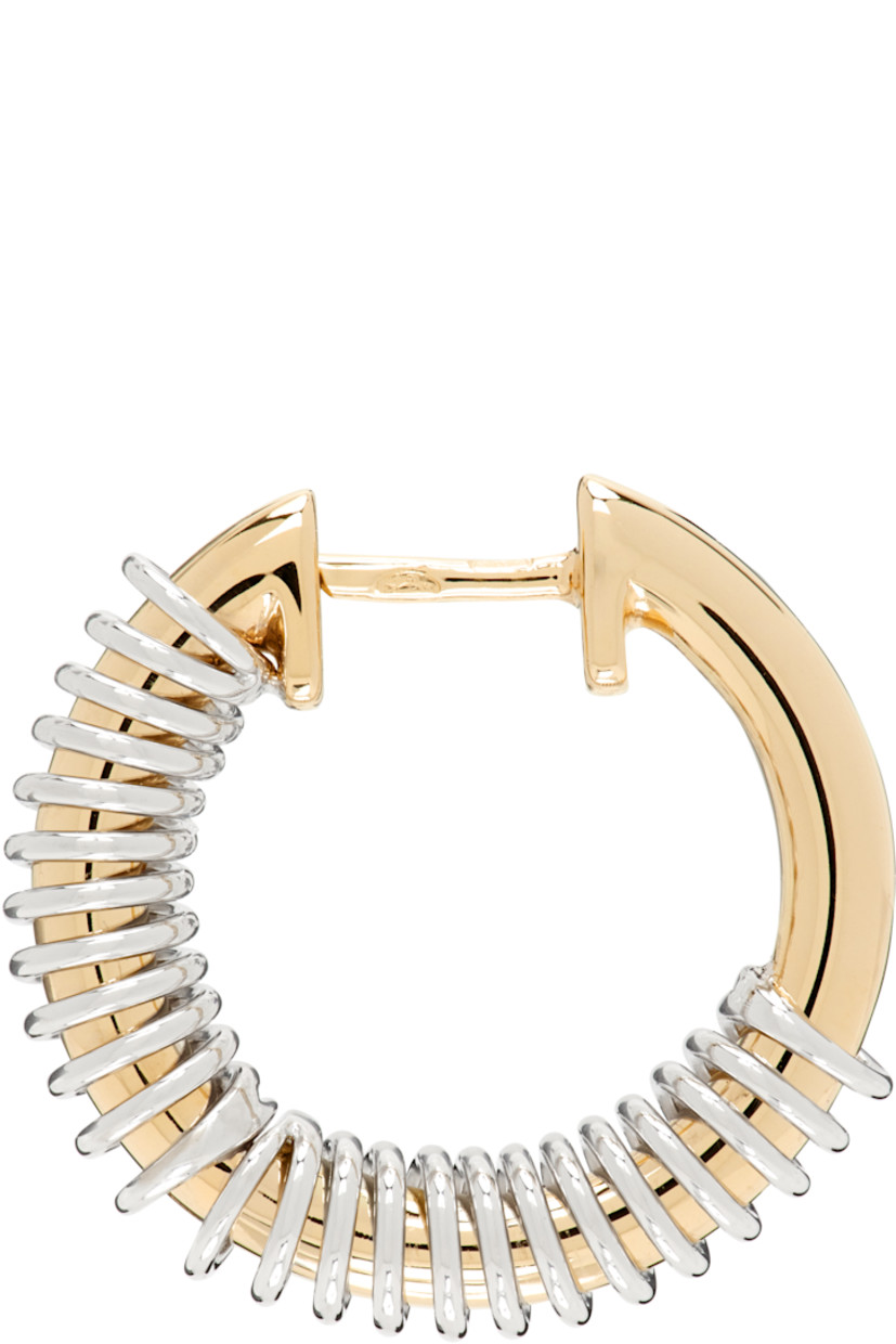 Single hoop earring in 14k gold and 14k white gold. 

· Hinged-post fastening 
· D0.5"

Supplier color: 14k yw