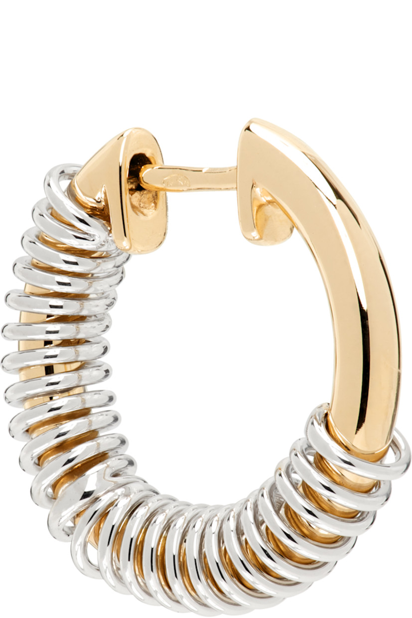Single hoop earring in 14k gold and 14k white gold. 

· Hinged-post fastening 
· D0.5"

Supplier color: 14k yw