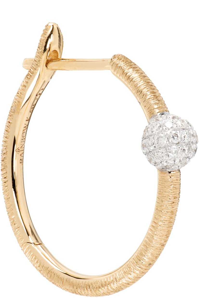 Single hoop earring in 14k gold. 

· Pavé-set 0.14 cttw diamonds 
· Hinged-post fastening 
· D0.75"

Supplier color: 14k yg