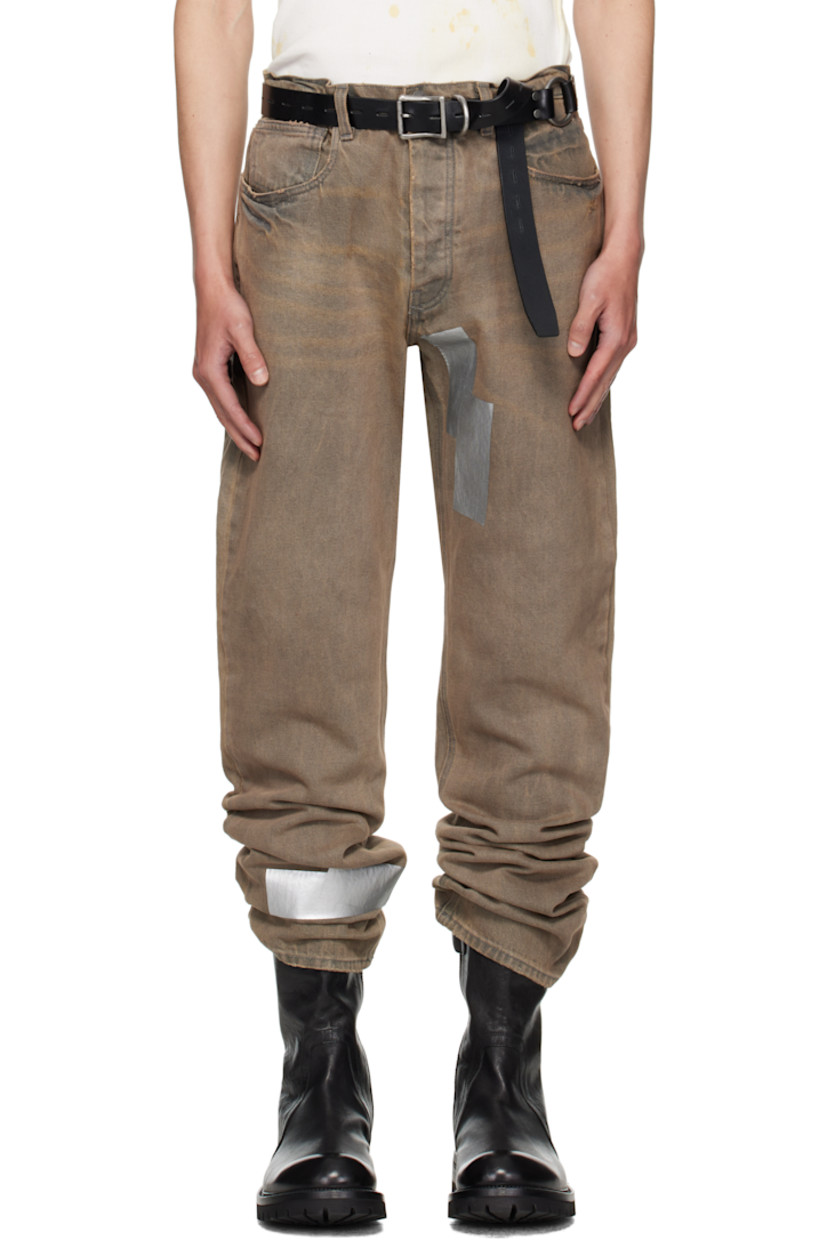 Straight-leg non-stretch denim jeans. 

· Fading, whiskering, distressing, and tape accents throughout 
· Belt loops
· Five-pocket styling
· Button fly 
· Logo patch at back waistband

Supplier color: Washed grey