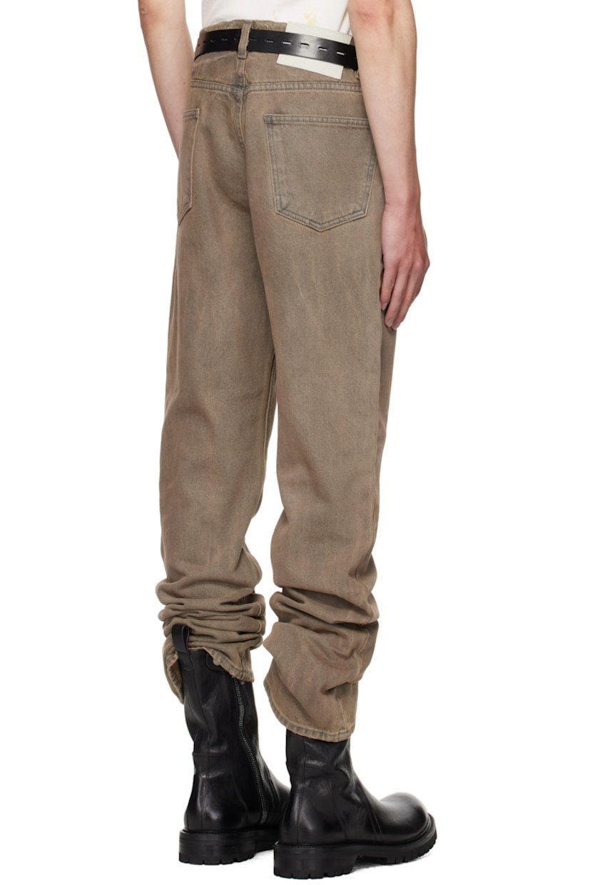 Straight-leg non-stretch denim jeans. 

· Fading, whiskering, distressing, and tape accents throughout 
· Belt loops
· Five-pocket styling
· Button fly 
· Logo patch at back waistband

Supplier color: Washed grey