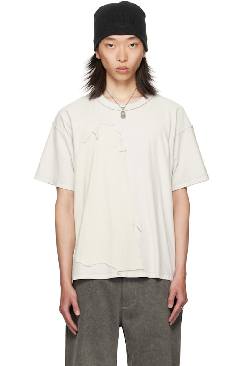 Cotton jersey T-shirt. 

· Exposed seams throughout 
· Rib-knit crewneck
· Jersey appliqué with rolled edges at front 
· Dropped shoulders

Supplier color: Light oil
