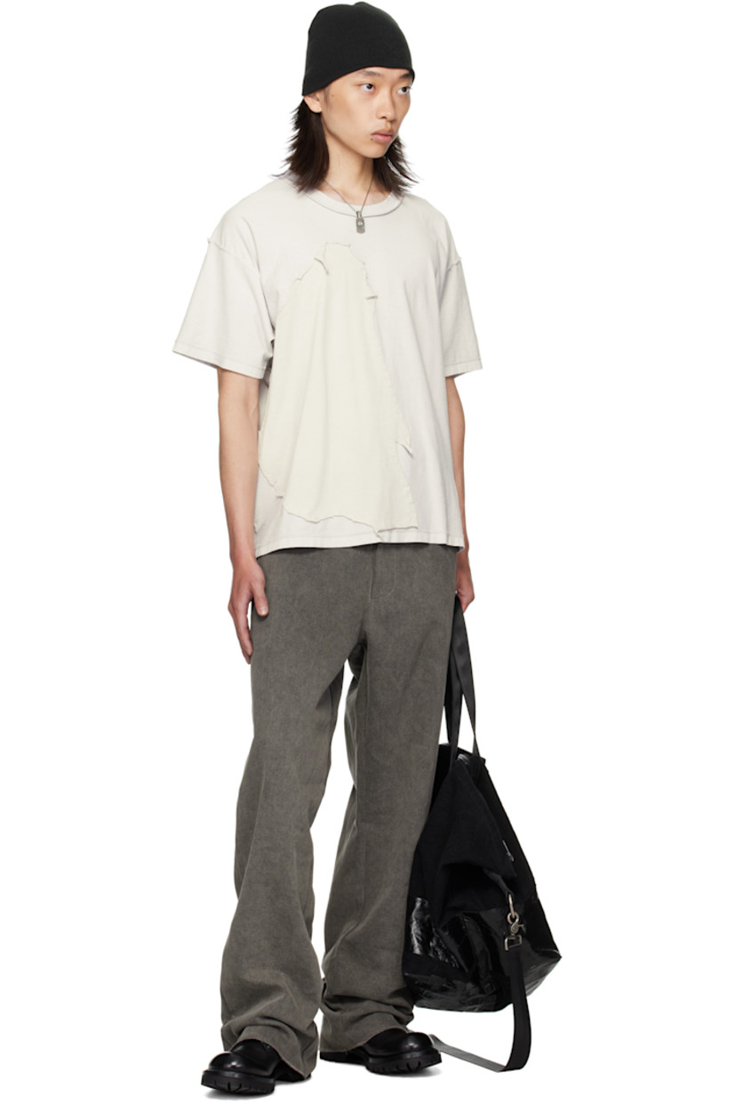 Cotton jersey T-shirt. 

· Exposed seams throughout 
· Rib-knit crewneck
· Jersey appliqué with rolled edges at front 
· Dropped shoulders

Supplier color: Light oil