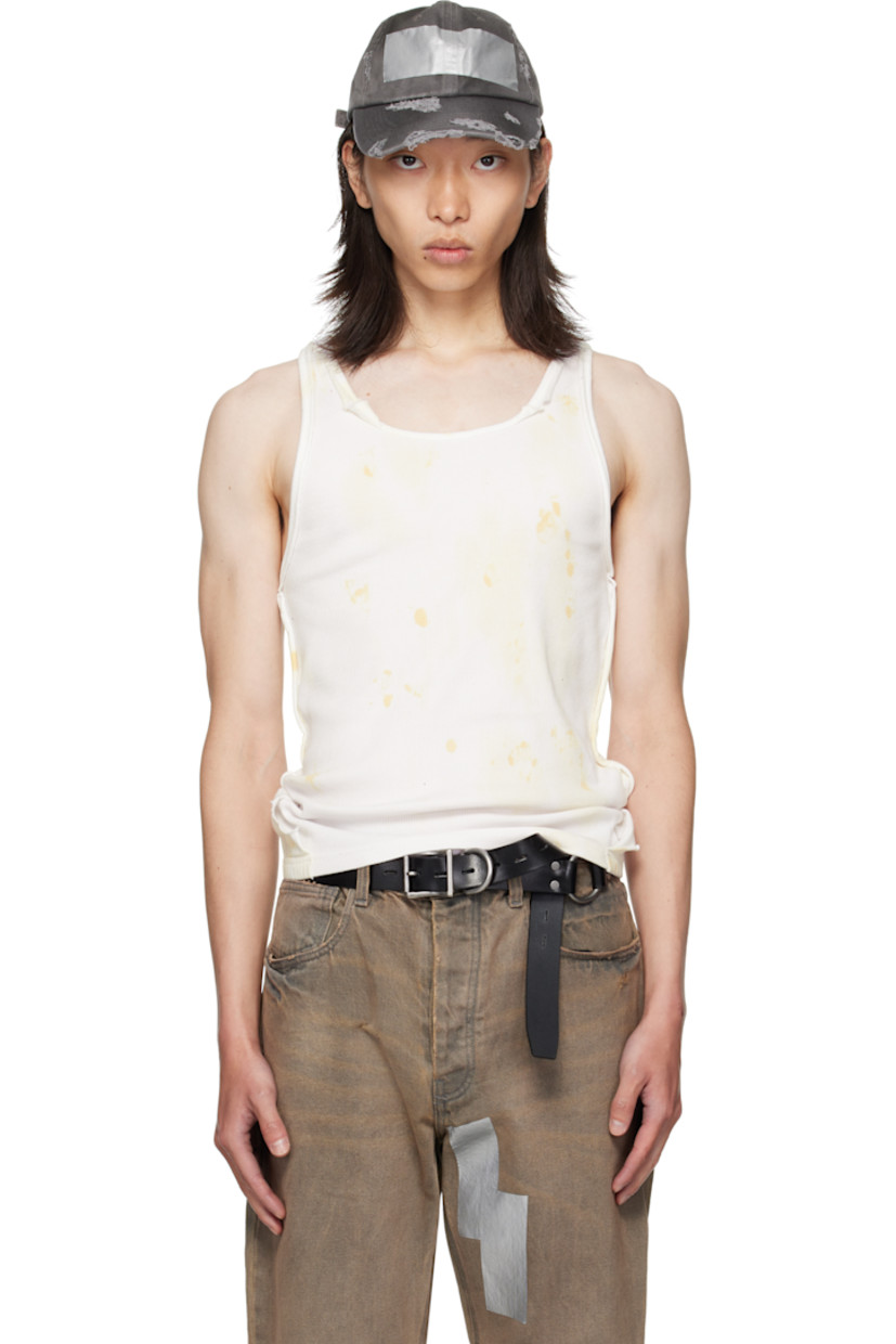 Cotton ribbed jersey tank top. 

· Discoloration throughout
· Scoop neck
· Jersey trim with rolled edges throughout 

Supplier color: Rust