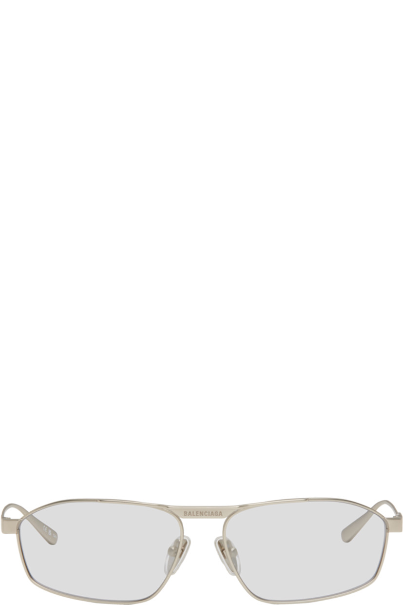 Rectangular metal-frame sunglasses in silver tone.

· Gray lenses
· Logo engraved at face
· Adjustable rubber nose pads
· Includes case
· Size: 63.16 140

Supplier color: Silver