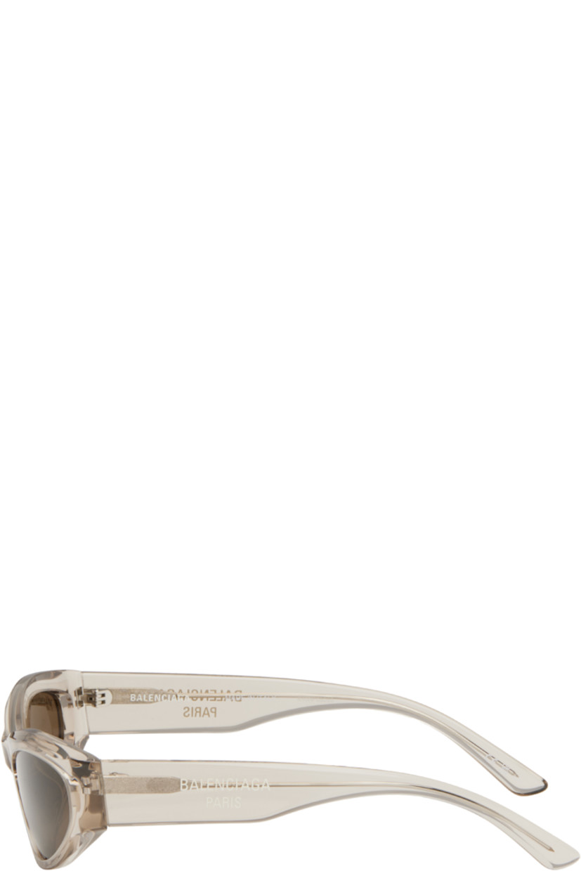 Cat-eye transparent acetate-frame sunglasses in beige.

· Brown lenses
· Logo etched at lens
· Integrated nose pads
· Logo printed at temples 
· Exposed core wires
· Includes case
· Size: 58.19 140

Supplier color: Beige