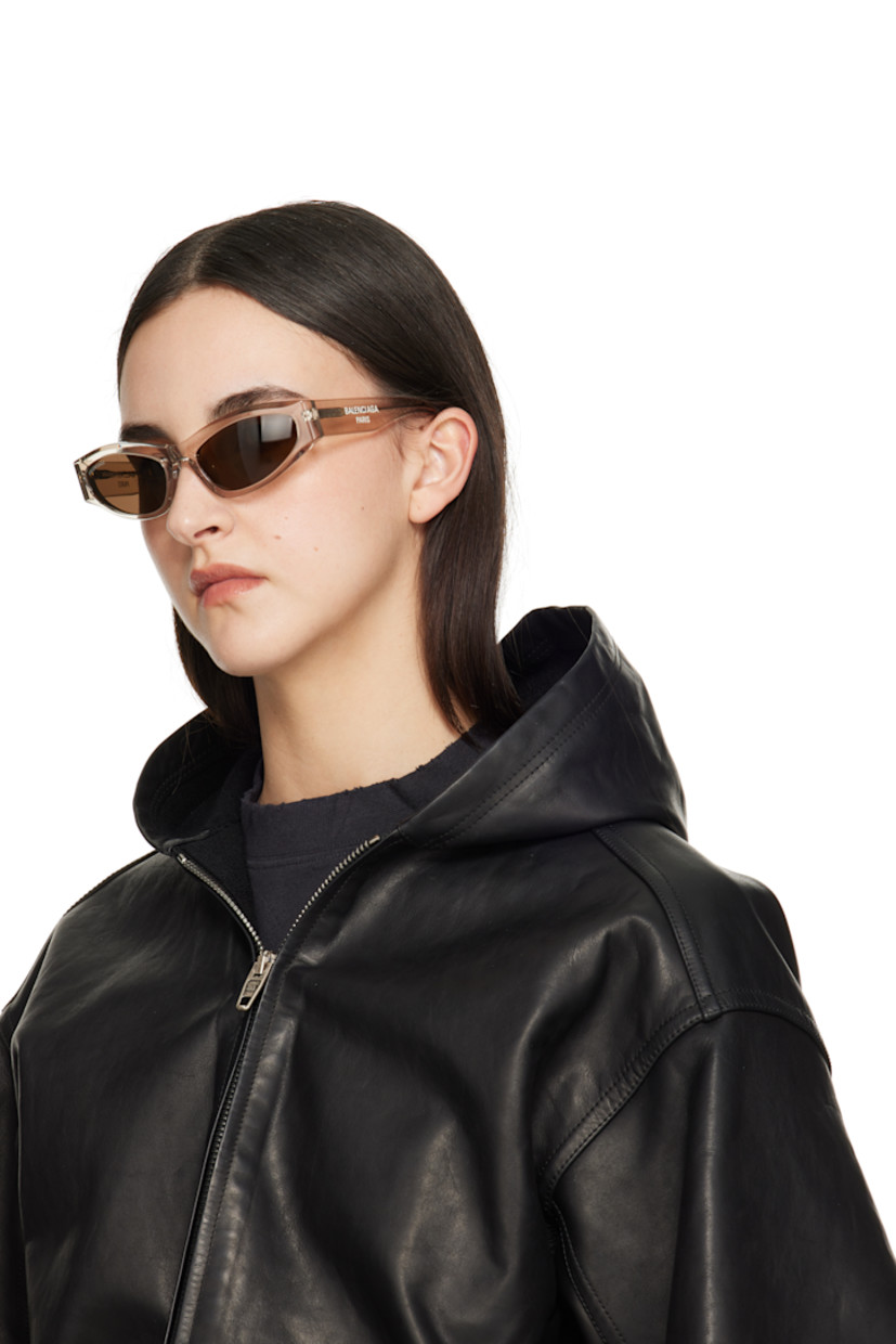 Cat-eye transparent acetate-frame sunglasses in beige.

· Brown lenses
· Logo etched at lens
· Integrated nose pads
· Logo printed at temples 
· Exposed core wires
· Includes case
· Size: 58.19 140

Supplier color: Beige