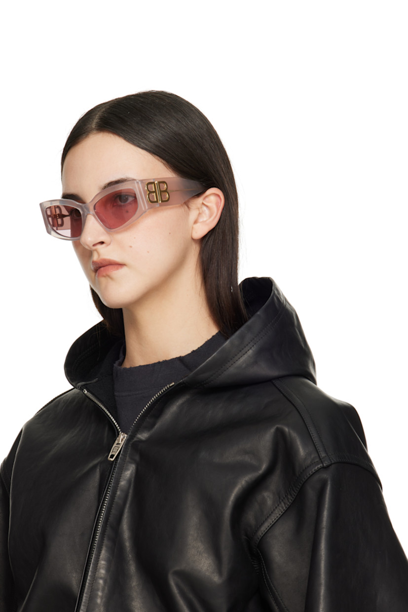 Cat-eye transparent Eastman Acetate Renew™-frame sunglasses in pink.

· Pink lenses
· Logo etched at lens 
· Integrated nose pads
· Logo hardware at hinges
· Exposed core wires
· Includes case
· Size: 57.17 145

Supplier color: White
