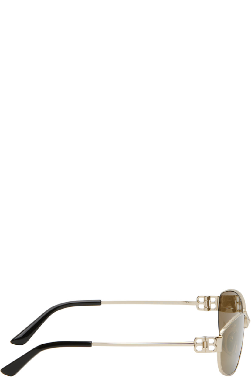 Rectangular metal-frame sunglasses in gold tone.

· Brown lenses
· Logo etched at lenses
· Adjustable rubber nose pads
· Logo hardware at hinges
· Acetate temple tips
· Includes case
· Size: 65.16 140

Supplier color: Gold
