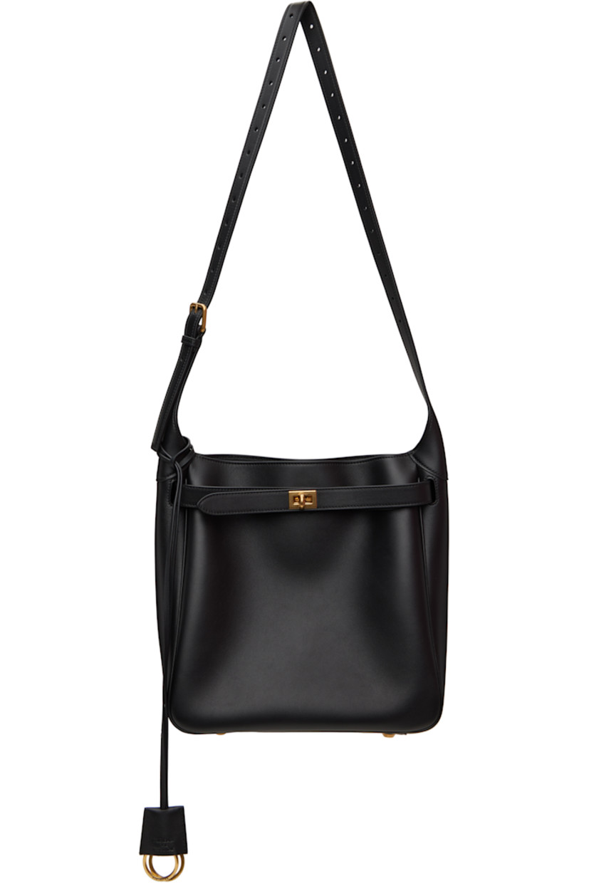 Buffed calfskin shoulder bag in black.

· Detachable sheathed keyrings at adjustable crossbody strap
· Detachable straps at face
· Bumper studs at face
· Turn-lock closure
· Zip pocket at interior
· Bonded nappa lambskin lining
· Logo-engraved antiqued gold-tone hardware
· H10.5" x W10.25" x D4"

Supplier color: Black