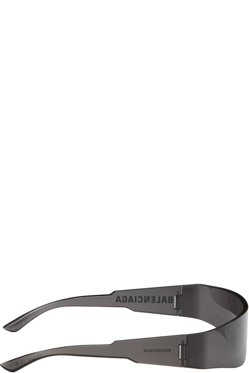 Wraparound rimless acetate-frame sunglasses in black. 

· Gray lens
· 100% UVA/UVB protection, category 1 
· Adjustable rubber nose pads
· Logo printed at temple 
· Includes case
· Size: 125

Supplier color: Grey/Grey/Grey