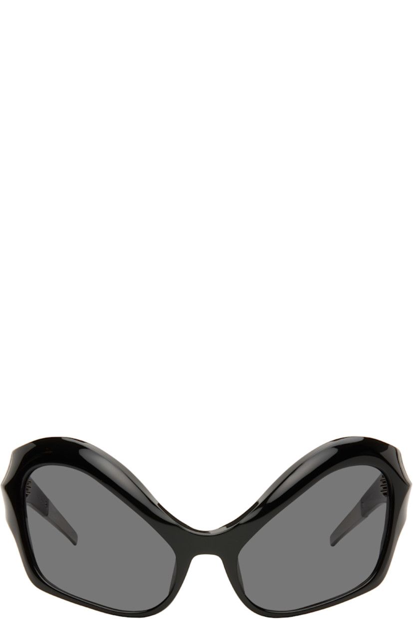 Modified cat-eye acetate-frame sunglasses.

· Integrated nose pads
· Black lenses with 100% UVA/UVB protection
· Logo etched at temples
· Hardware at temple tips
· Titanium hardware
· Logo-embossed squeeze-top pouch
· Size: 58.20 120

Supplier color: Black