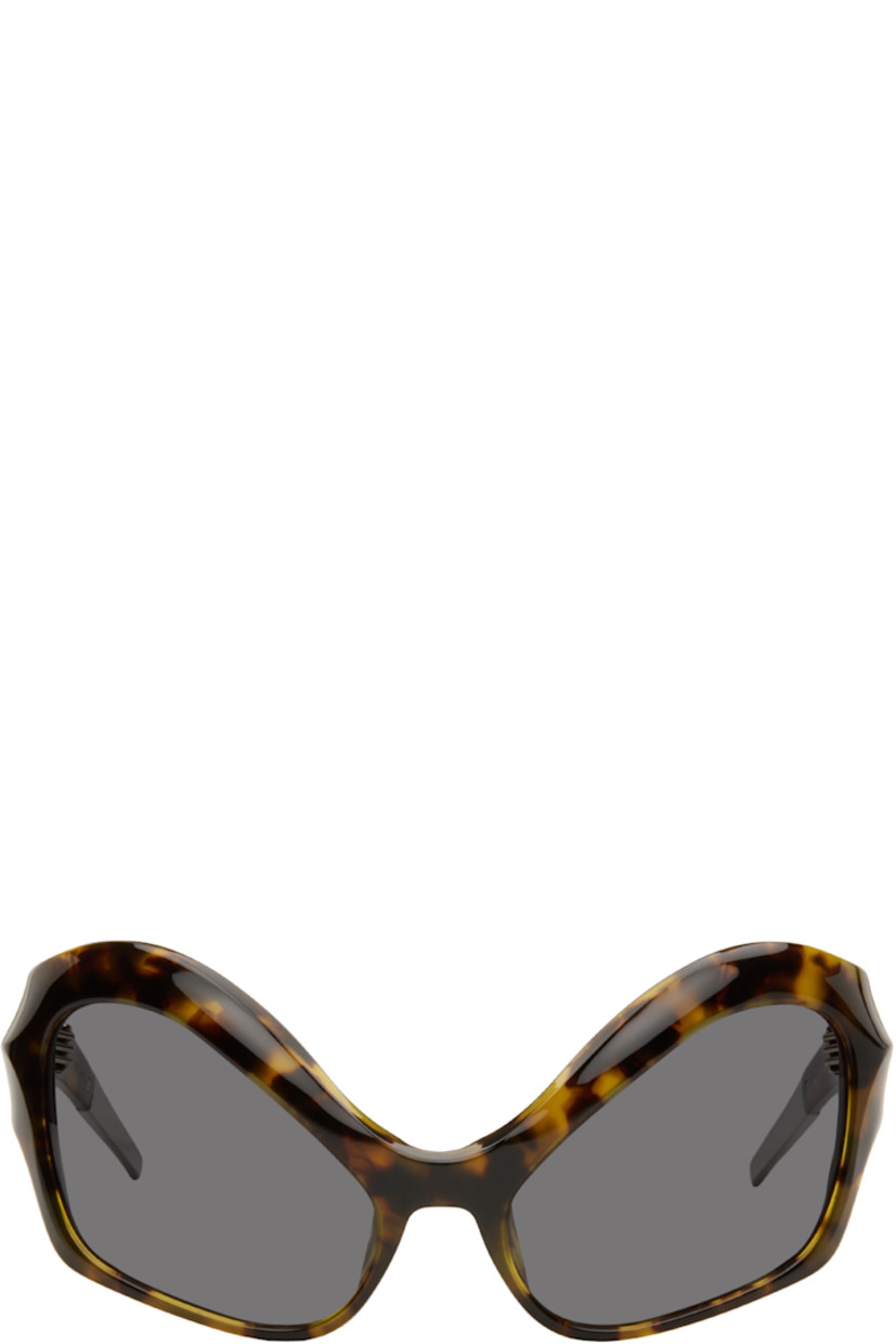 Modified cat-eye tortoiseshell acetate-frame sunglasses.

· Integrated nose pads
· Black lenses with 100% UVA/UVB protection
· Logo etched at temples
· Hardware at temple tips
· Titanium hardware
· Logo-embossed squeeze-top pouch
· Size: 58.20 120

Supplier color: Tortoise