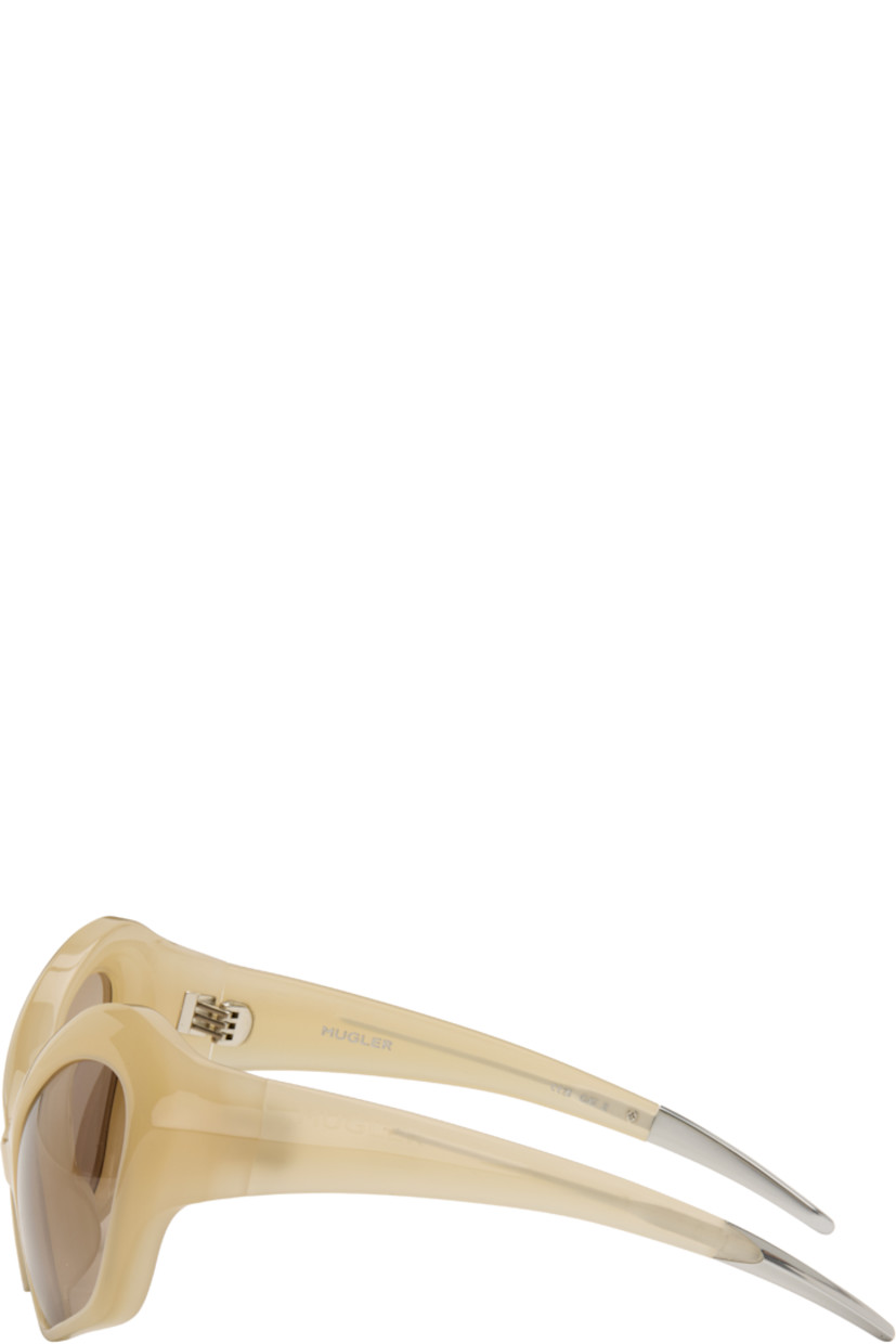 Modified cat-eye acetate-frame sunglasses.

· Integrated nose pads
· Brown lenses with 100% UVA/UVB protection
· Logo etched at temples
· Hardware at temple tips
· Titanium hardware
· Logo-embossed squeeze-top pouch
· Size: 58.20 120

Supplier color: Beige