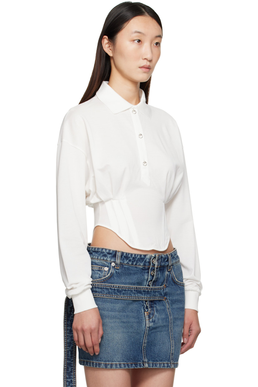 Cotton piqué polo.

· Rib-knit spread collar and cuffs
· Three-button placket with O-ring buttons
· Boning at curved hem
· Zip closure at side seam
· Dropped shoulders
· Logo plaque at back collar

Supplier color: Snow