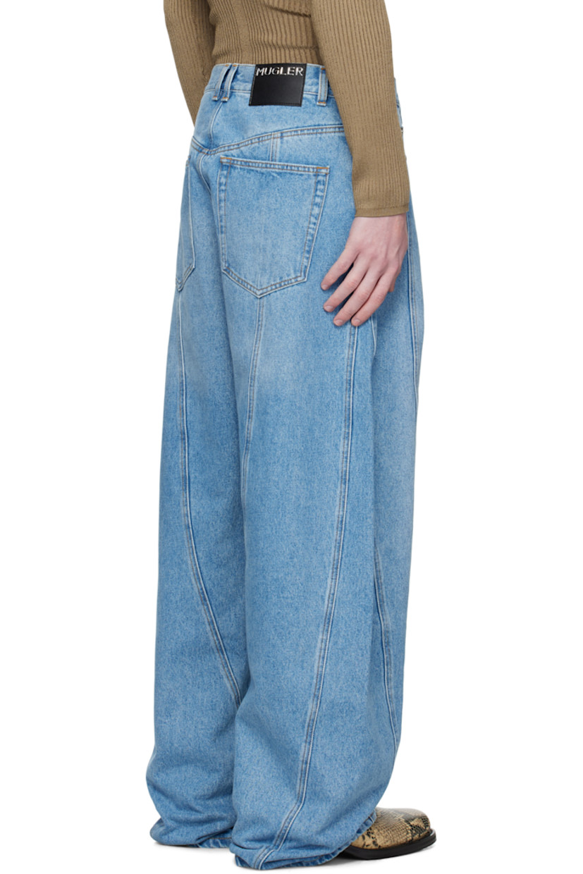 Non-stretch denim jeans.

· Paneled construction with twisted outseams
· Fading throughout
· Wide-leg
· High-rise
· Belt loops
· Five-pocket styling
· Zip fly
· Logo patch at back waistband
· Logo-engraved silver-tone hardware
· Contrast stitching in tan

Supplier color: Medium Blue