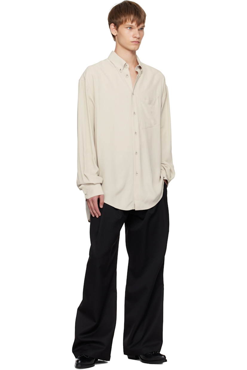 Plain-woven viscose shirt.

· Spread collar
· Graphic hardware at button closure
· Patch pocket at chest
· Droptail hem
· Buttoned barrel cuffs
· Pleats at back yoke

Supplier color: Sand
